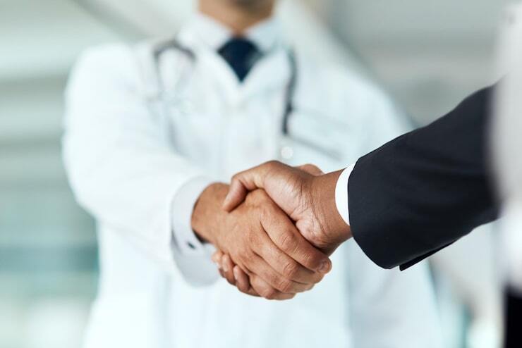 closeup-doctor-man-with-handshake-negotiation-planning-with-partnership-healthcare-wellness-medical-professional-consultant-employee-with-offer-suppo